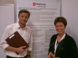 Roch Kowalski and Birgitte Offersen presenting a cross-border poster